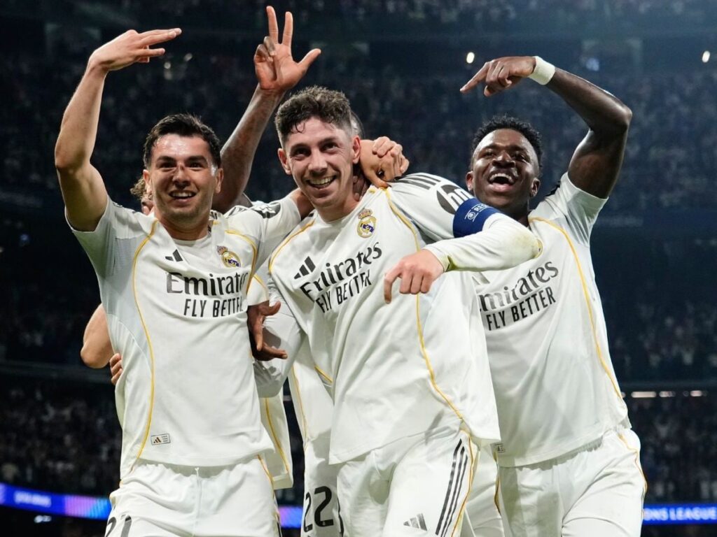 Federico Valverde celebrating his historic hat-trick against Manchester City with his teammates.